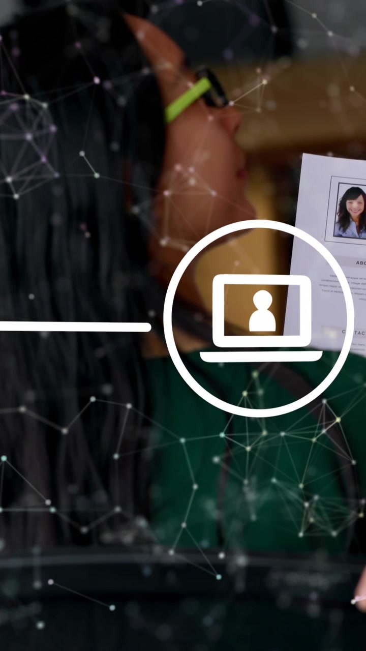 Animation of network of digital icons over rear view of asian woman discussing over a document