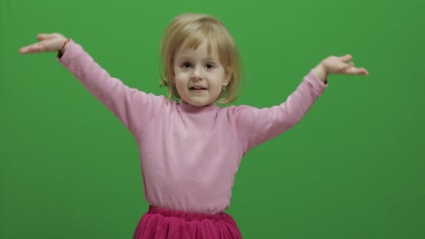 Happy-three-years-old-girl.-Cute-blonde-child.-Dancing-and-make-faces