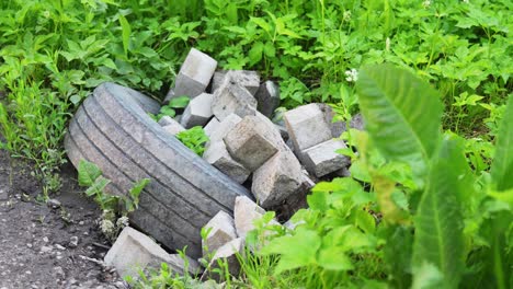 discarded off roader tyre with interlock bricks