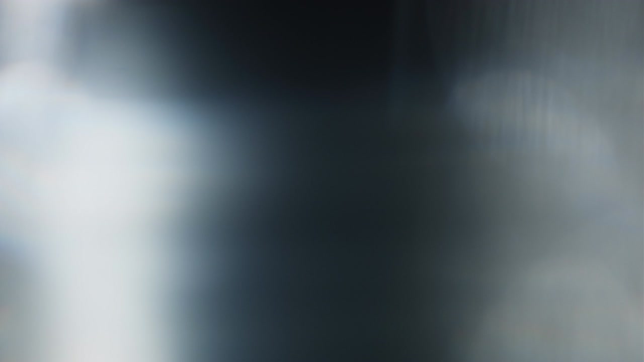 Abstract light leaks on black background.