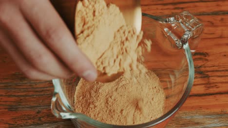 lite paprika with onion powder in a measuring glass jar