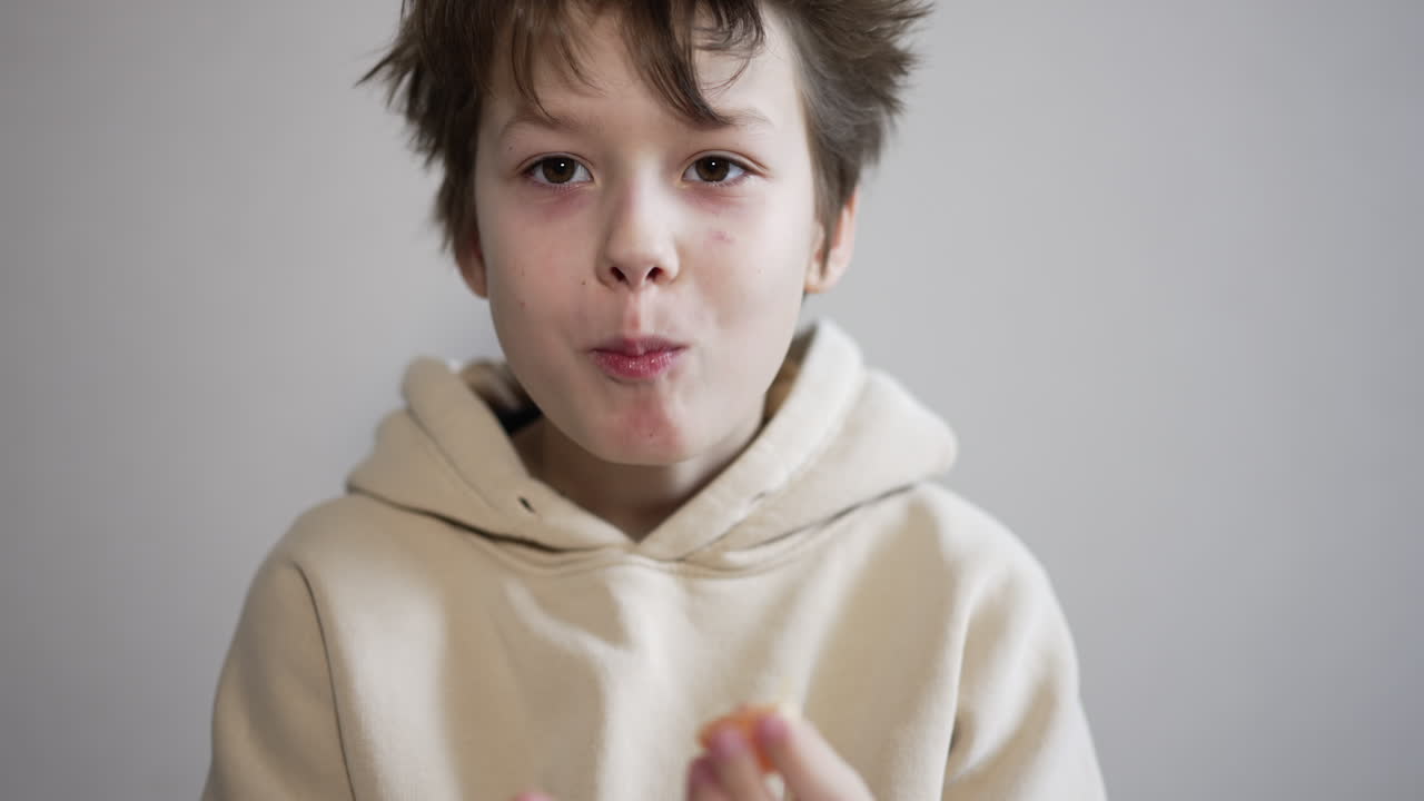 Child Eating an Orange
