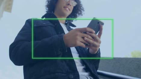 Animation-Eines-Grünen-Rahmens-über-Einem-Mann,-Der-Sein-Smartphone-Nutzt