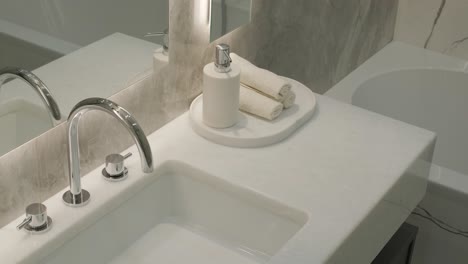 modern bathroom with marble walls and floating vanity