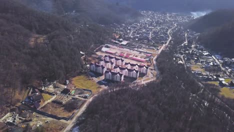 aerial view of a mountain village with new construction