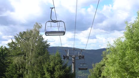 mountain cableway in summer sunny day