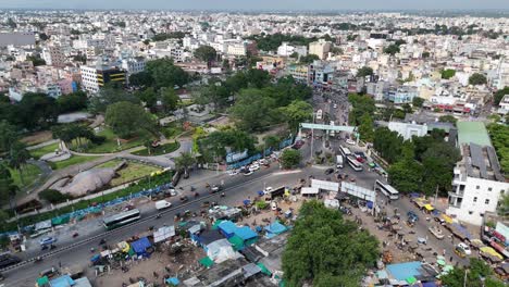 panoramic drone shot of high-rise buildings near highway road junction in amaravati.