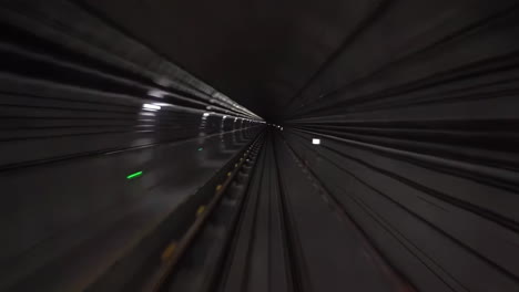 point of view pov subway underground metro moving automatic driverless train driving through tunnel