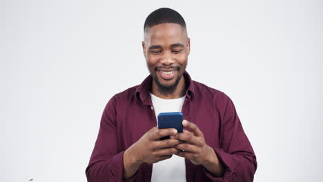 Phone,-message-and-black-man-laugh-in-studio