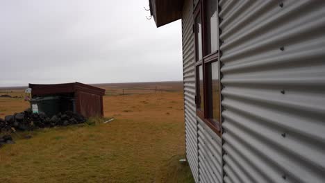 sheet metal construction next to winter landscape in iceland