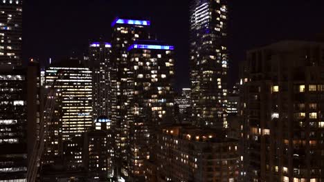 night view of city skyline with illuminated buildings