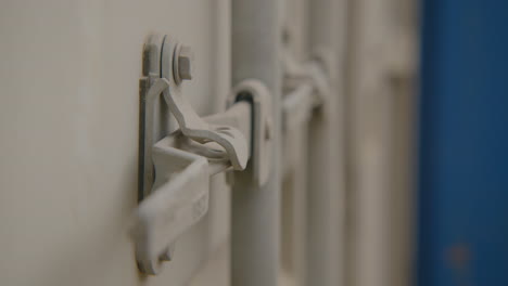 worker securing container latch