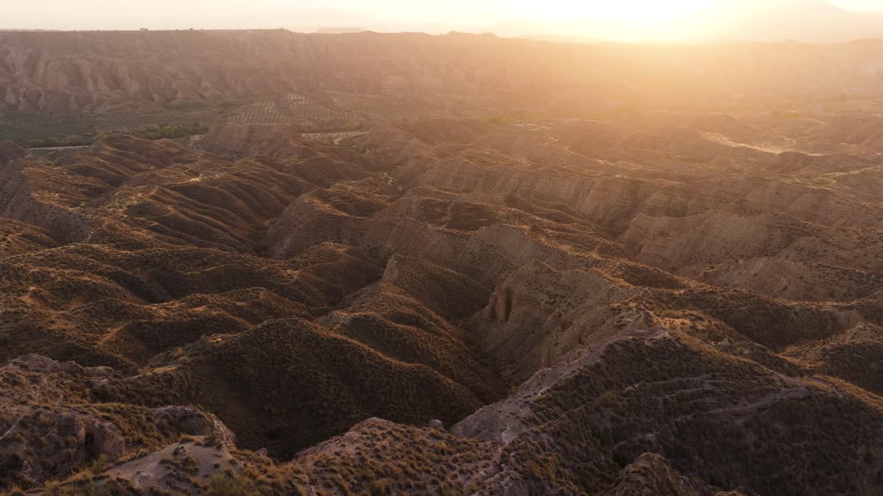 Aerial view of desert mountains and badlands