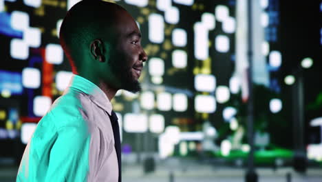 Businessman-admires-skyscrapers-at-night