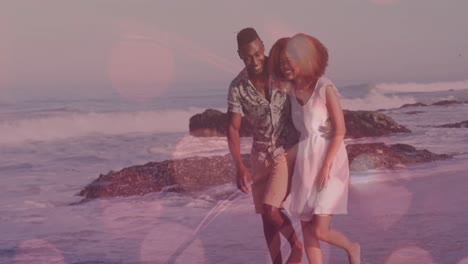 animación de puntos de luz sobre una pareja afroamericana caminando y tomados de la mano