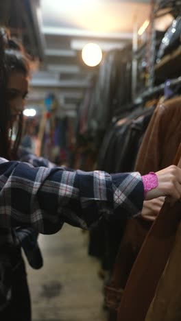 woman shopping for vintage clothing in a second-hand store