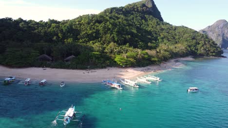 helicopter island beach in el nido with island-hopping tour boats