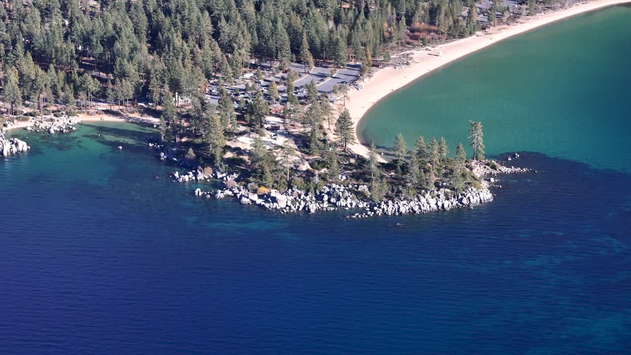 Aerial top down view of Sand Harbor beach with turquoise water and granite rocks in Lake Tahoe