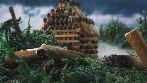 mini paisaje con stubs de casa de cerillas nevadas y humo en madera