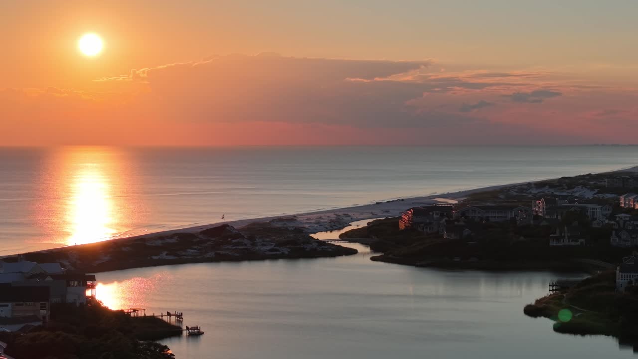 Amazing sunset over coastal Camp Creek Lake side flowing into calm gulf waters near Seacrest Beach, 30A, Florida, USA