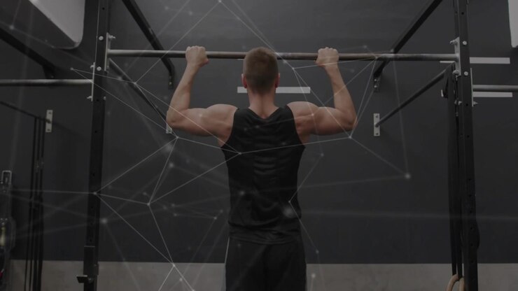 Man gripping pull-up bar initiating pull-up for fitness with network overlay mapping muscle