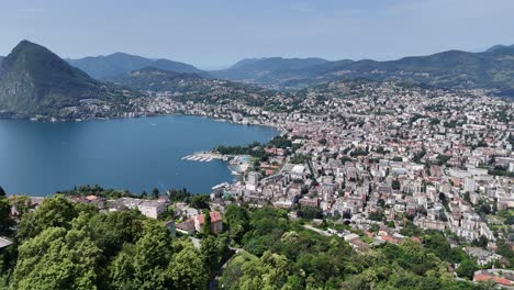 lugano city switzerland high aerial view panning shot 4k footage