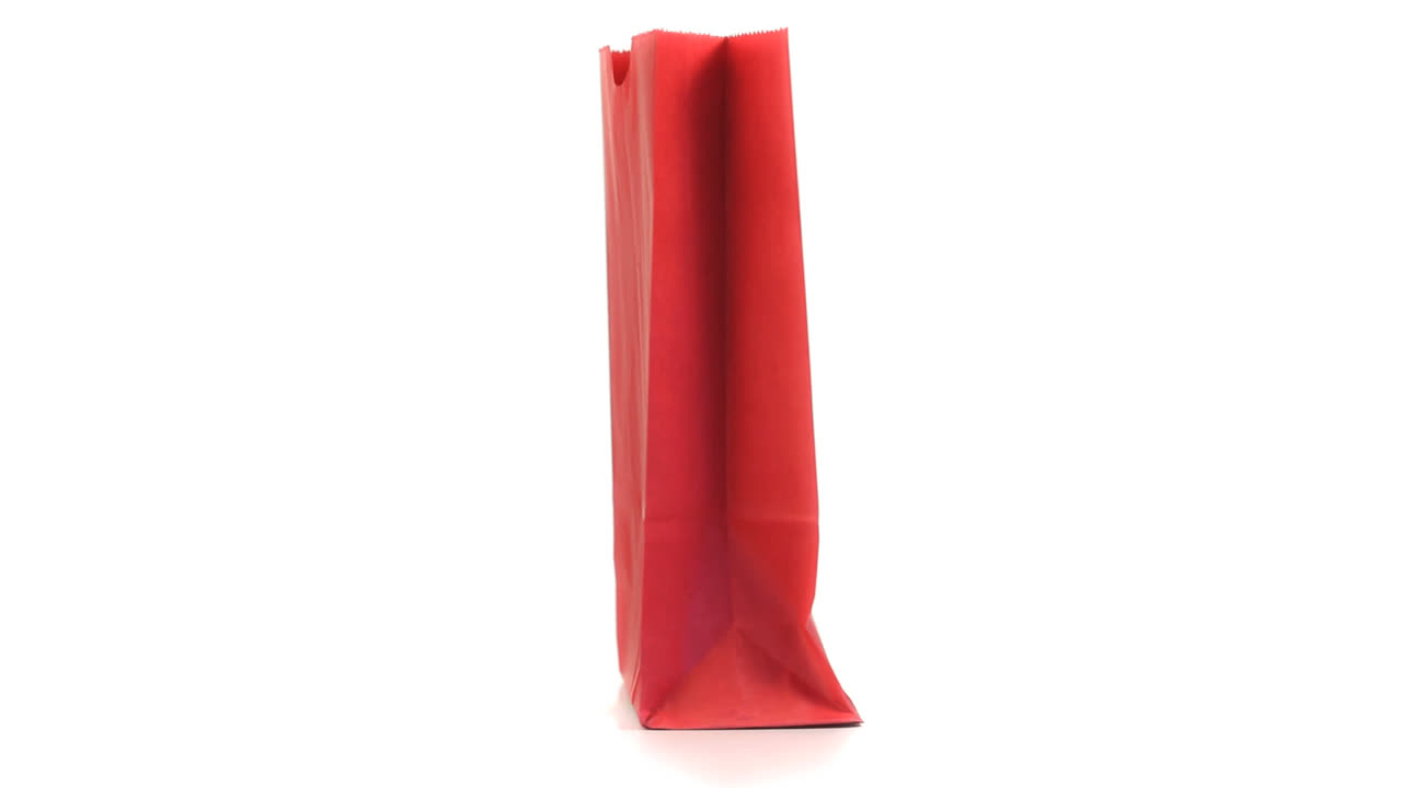 Red shopping bag turning on itself 