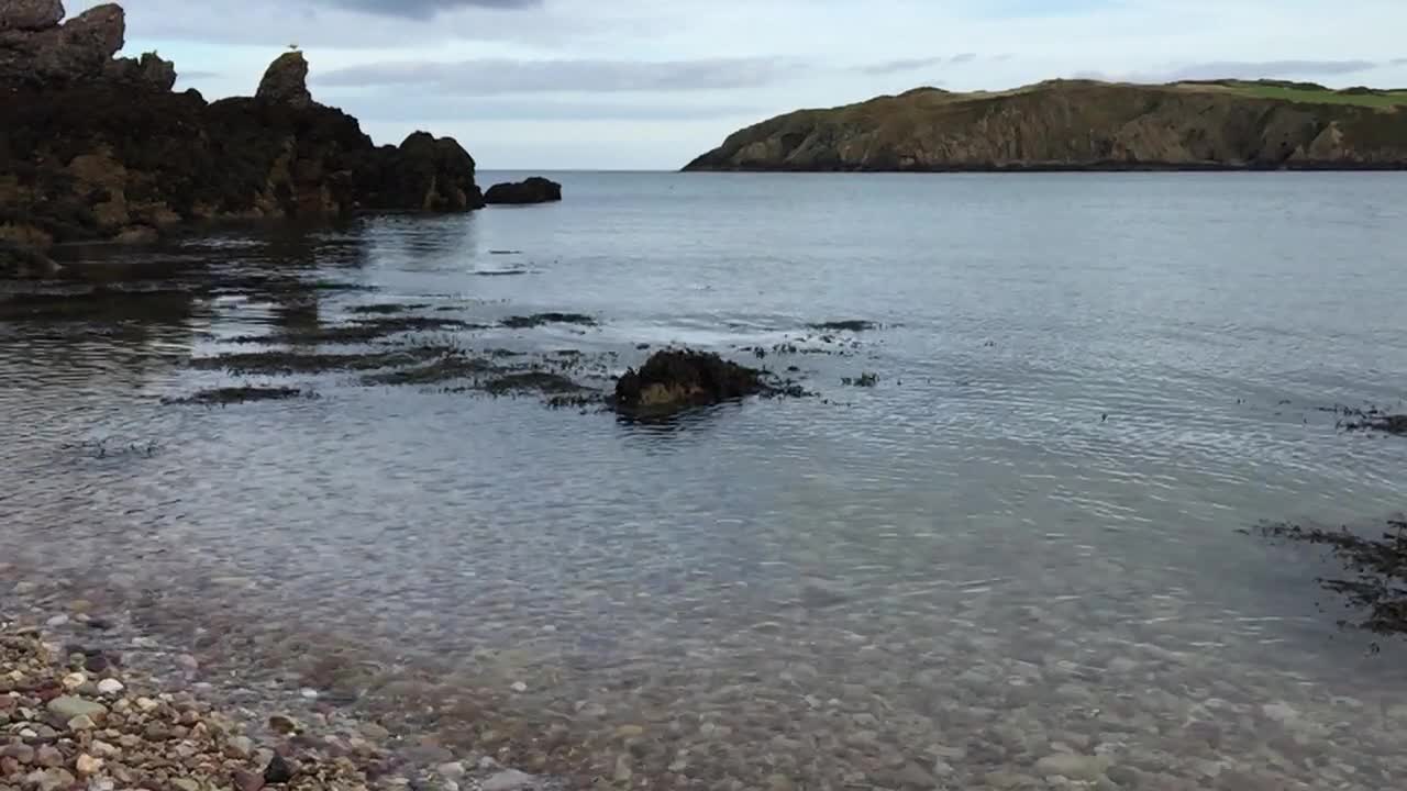 Slow Motion Rock landing in the ocean