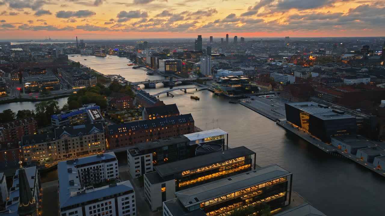 Aerial drone view of Borsen historical place in Copenhagen, Denmark at night
