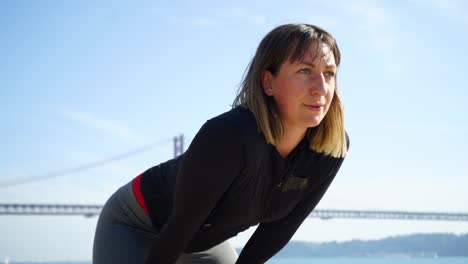 beautiful female athlete taking a break during workout