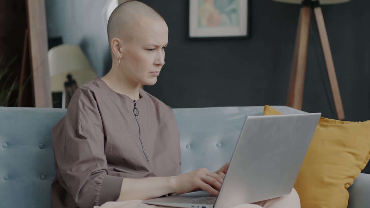 Woman working on laptop at home