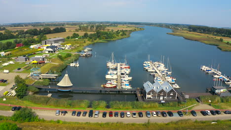 aerial shot of drone flying around marina in blotnik, pomeranian, poland