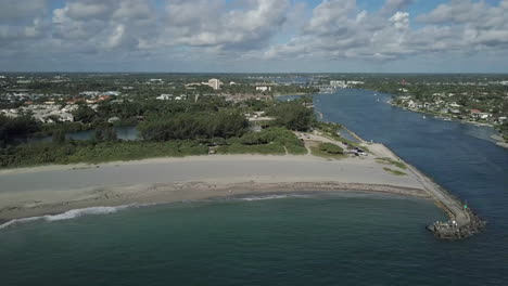 mouth of jupiter inlet with beach and jetty