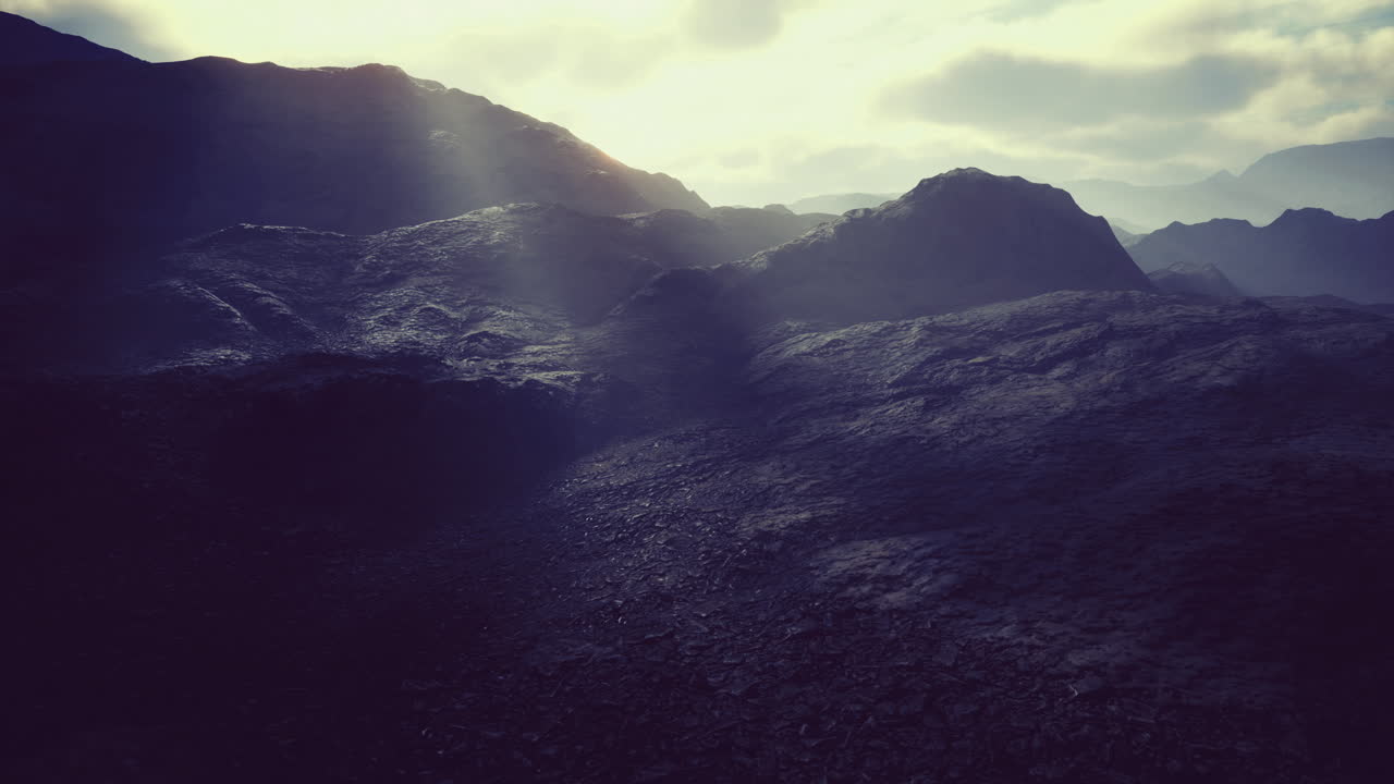 The rugged terrain features dark rocks illuminated by gentle sunlight