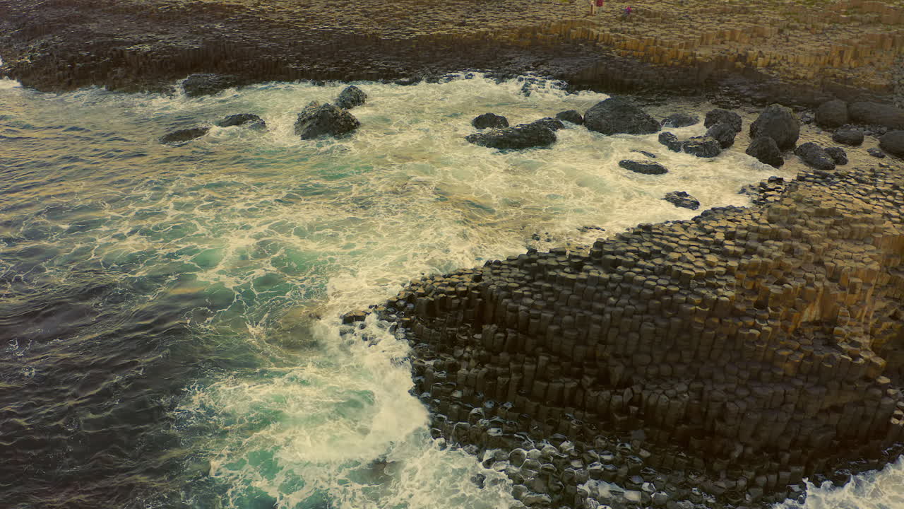 Giant's Causeway: Aerial View of Basalt Columns and Crashing Waves