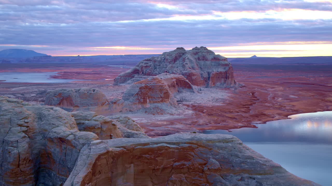 A cinematic drone shot moves gracefully around Glen Canyon’s towering formations, highlighting their intricate details.