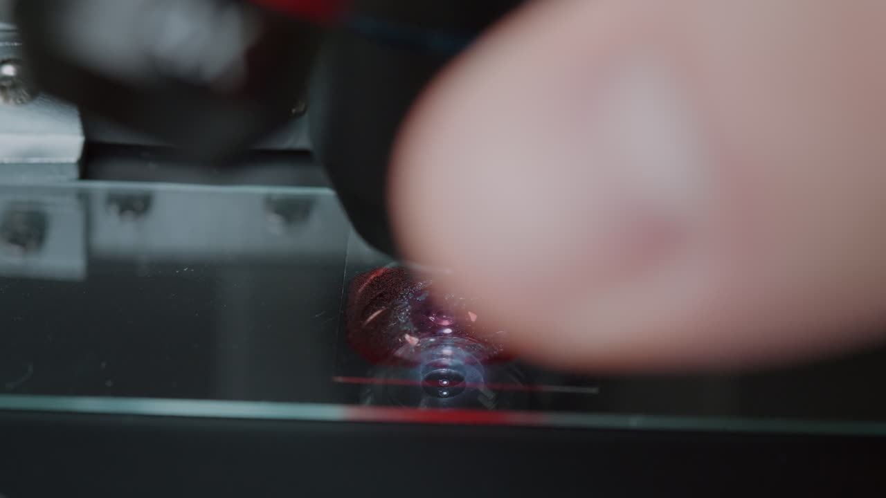 Microscope with optical lens examining blood sample