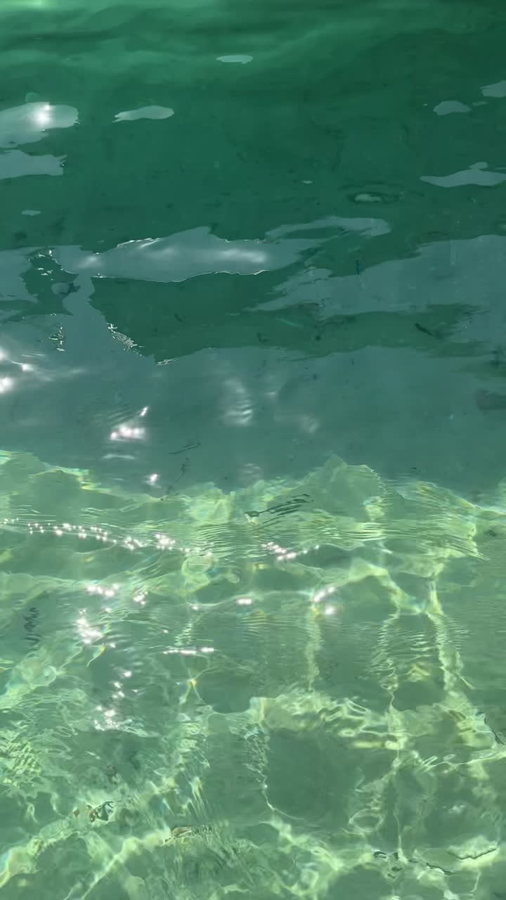 Underwater view of sunlit water