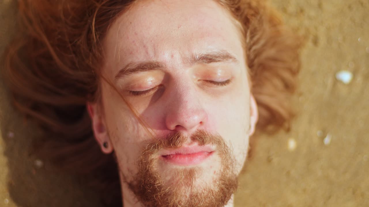 Serene Man Relaxing on the Beach