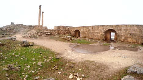 ruins of urfa castle two columns cloudy wintry day