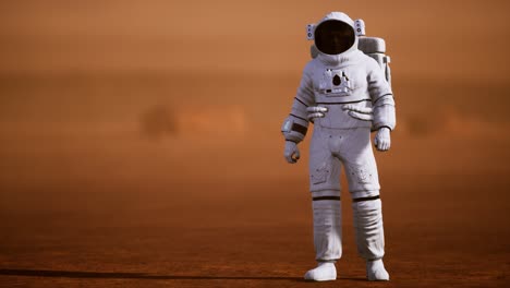 astronauta en la superficie de marte. planeta rojo cubierto de gas y roca