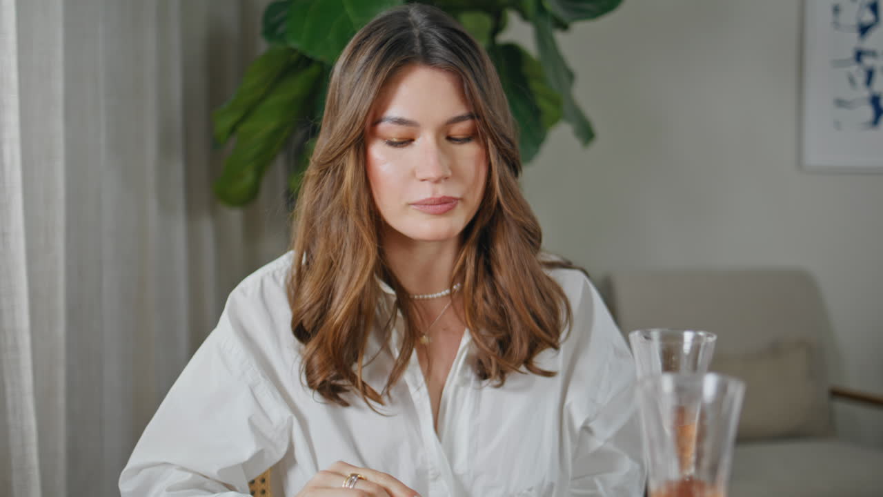 Friends eating birthday cake enjoying home party closeup. Relaxed woman talking