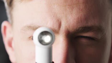 Doctor-using-otoscope-for-examination