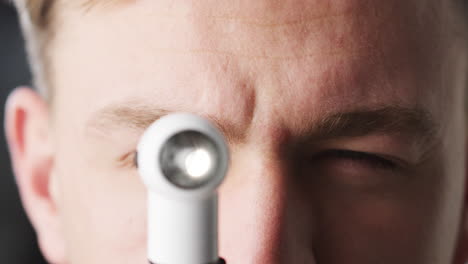 doctor using otoscope for examination