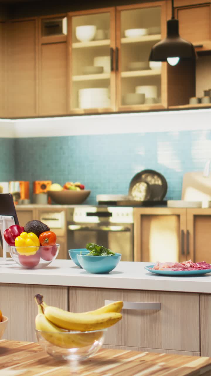 Vertical Video Comfortable kitchen setup with pizza ingredients on a modern countertop