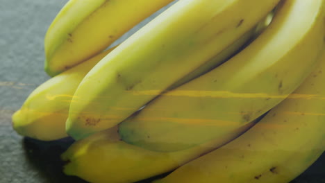 stacking bananas with sunset landscape overlay creates vibrant animation effect