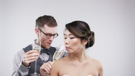 geek couple pulling funny faces slow motion wedding photo booth series