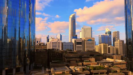 morning sunrise timelapse with the modern city architecture of abu dhabi skyline with beautiful clouds, uae