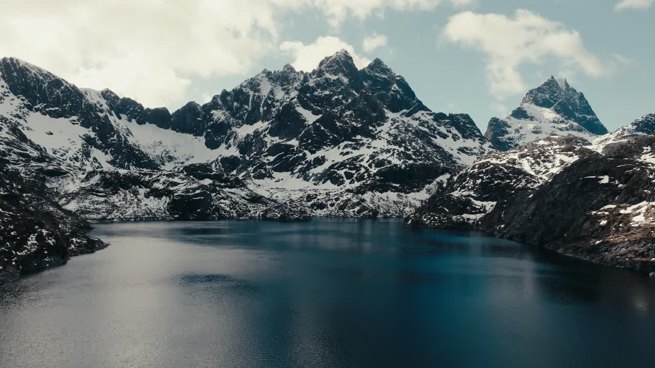 Aerial View Of Rocky Mountains Around The Lake In Winter In Lofoten Island, Nordland, Norway. - ascend shot