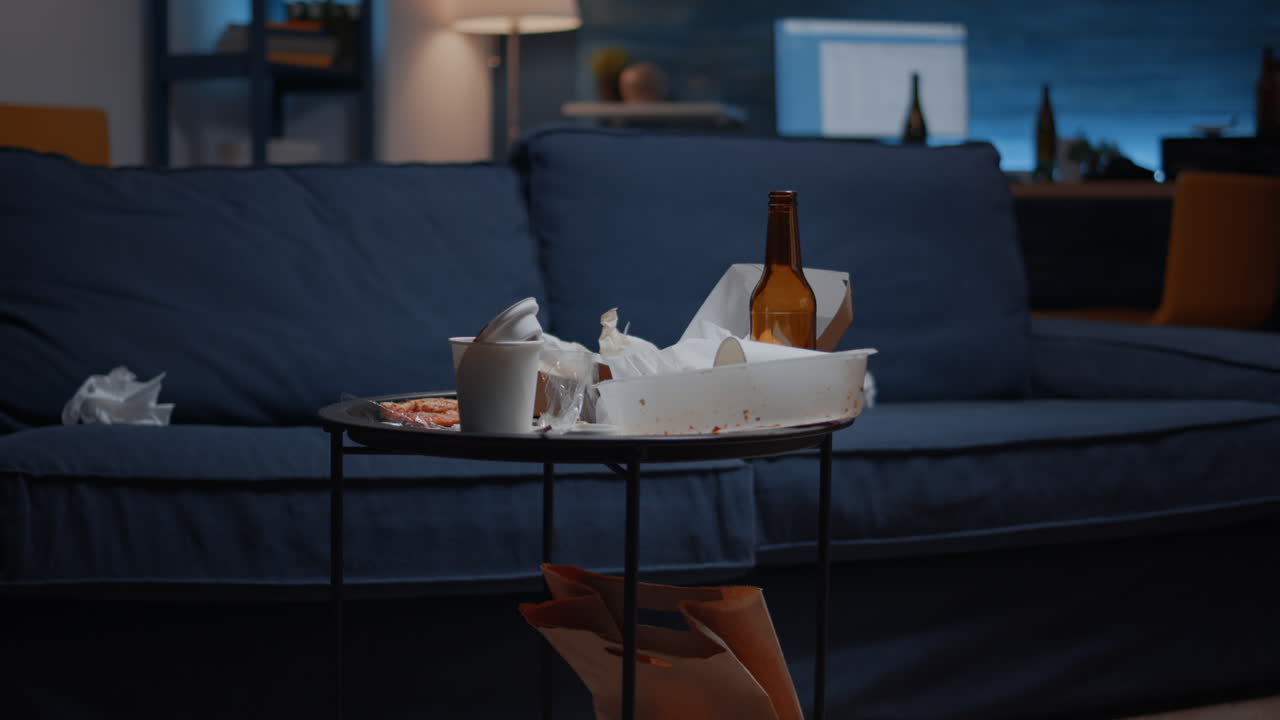 Close up of table with food and booze leftover on misery table